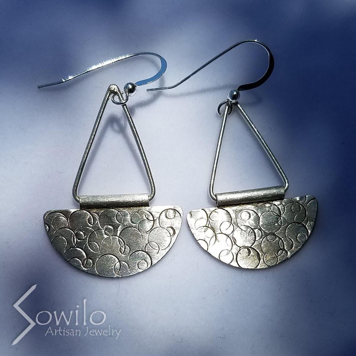 A pair of silver fan earrings