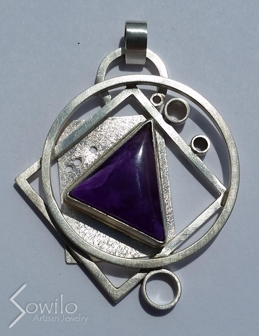 A pendant with a purple gem